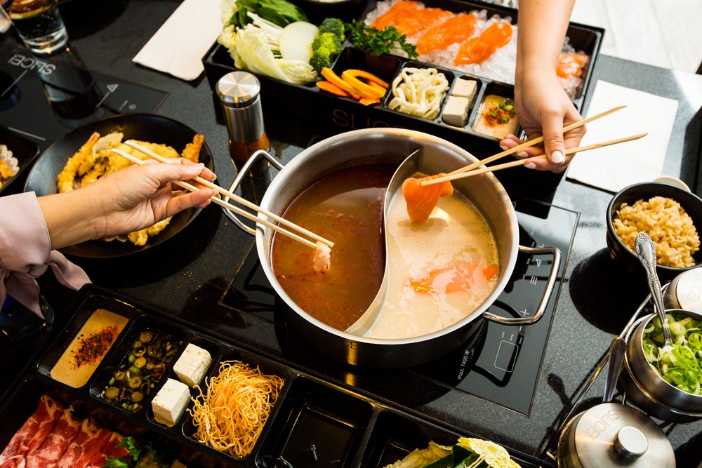 Slanted Down View of a dining table filled with Shabu
